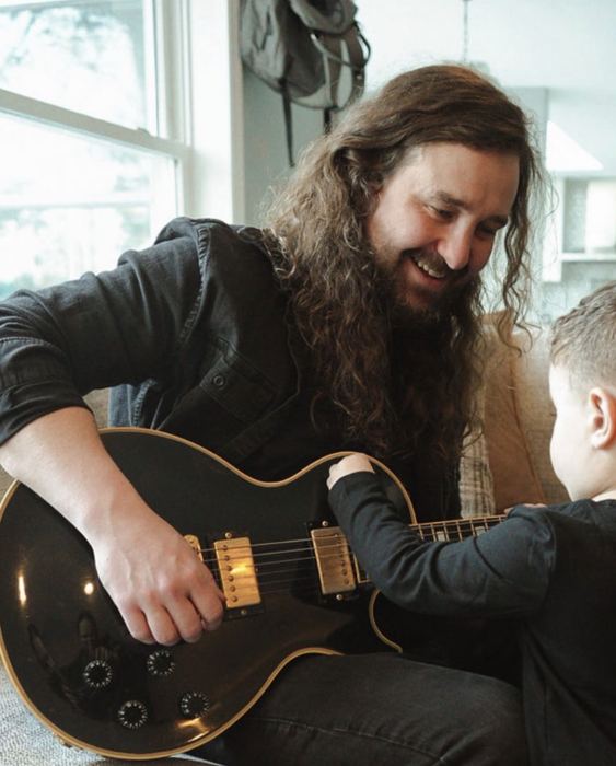 Brian at home with his black Les Paul